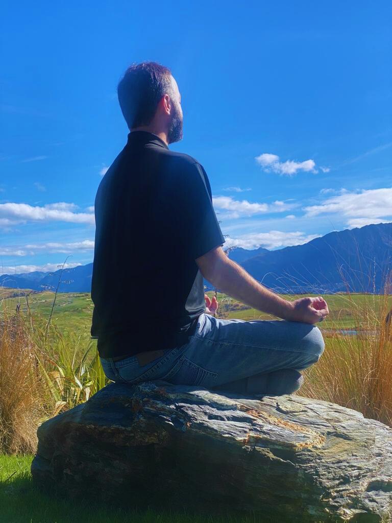 Trey Henderson meditating outdoors